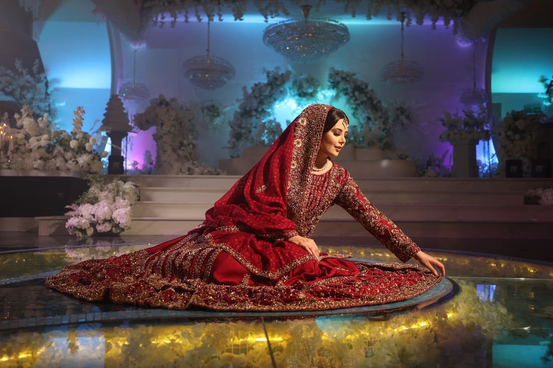 Bride in red on a glowing stage