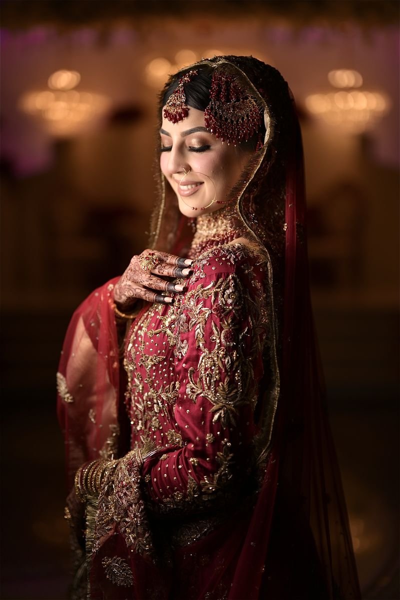Bride in red with gold jewellery