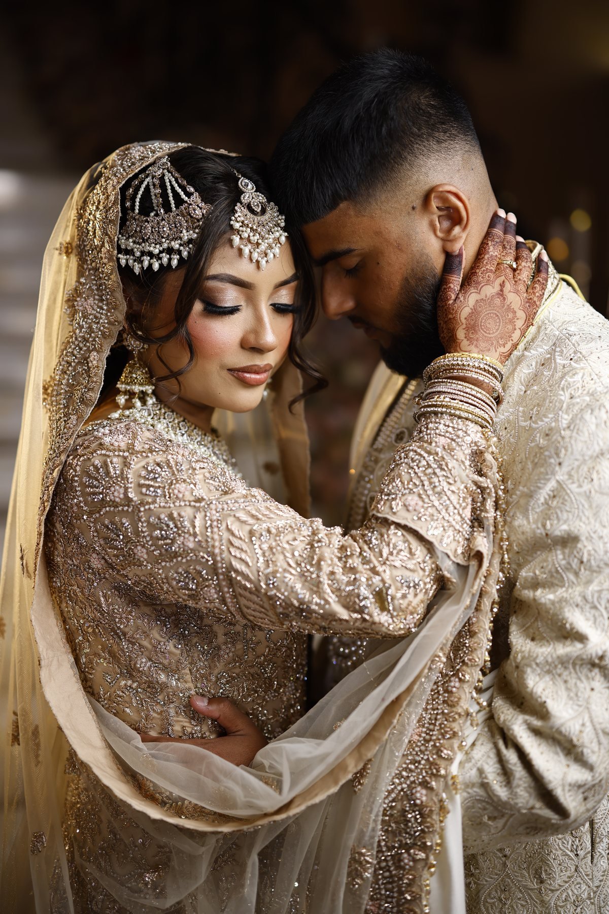 Groom embracing his bride
